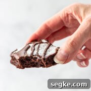 A keto brownie with a bite taken out of it.