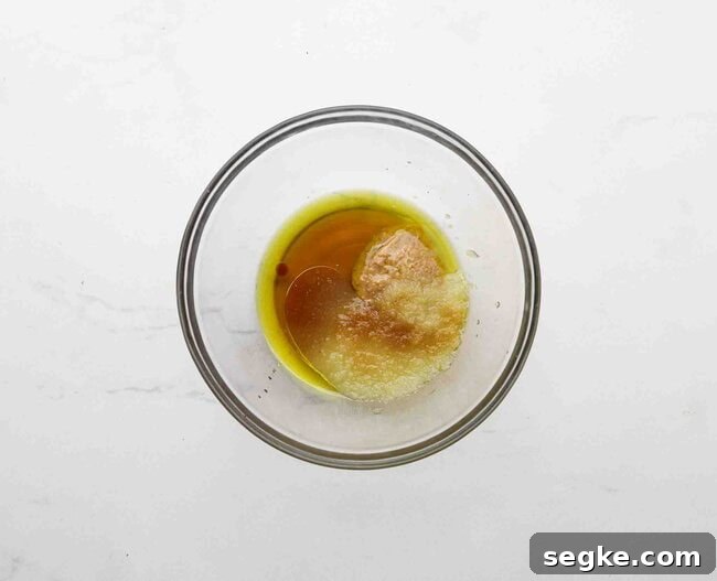No-Bake Chocolate Chip Energy Bites 3 Olive oil, maple syrup, and applesauce in a bowl.