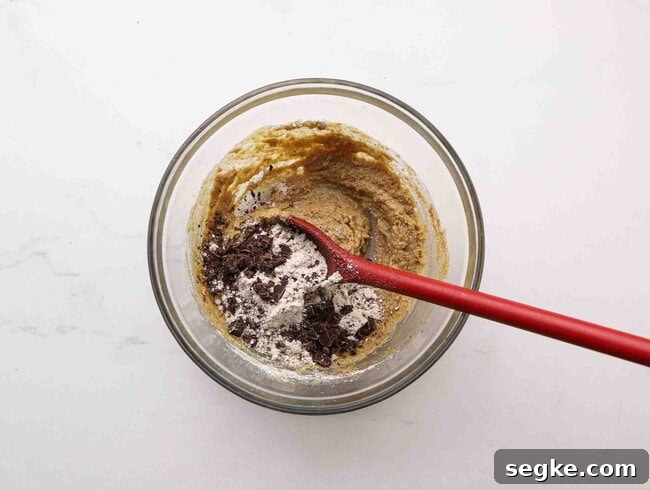 No-Bake Chocolate Chip Energy Bites 4 Stirring cookie dough.