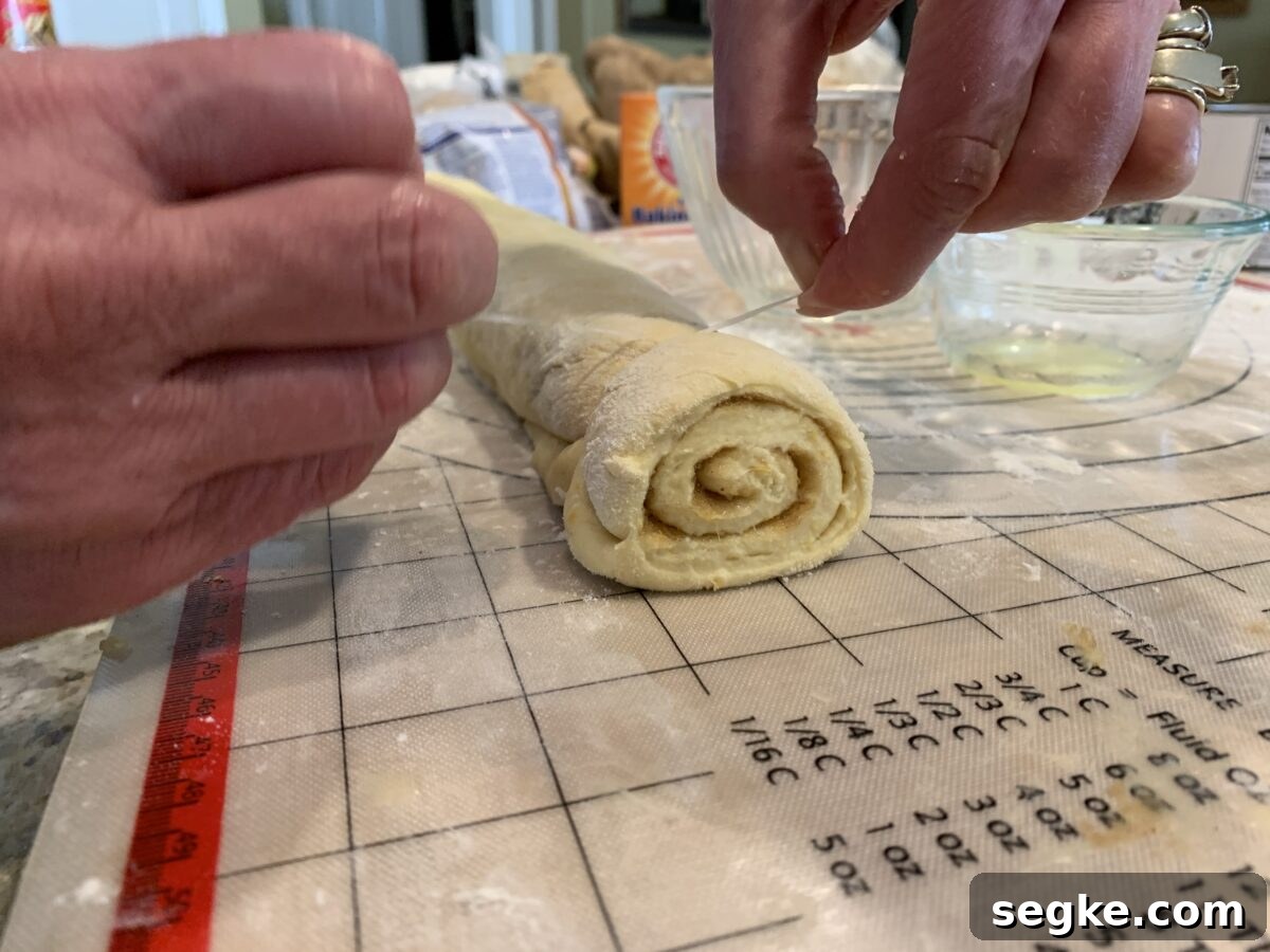 Sweet roll dough being sliced