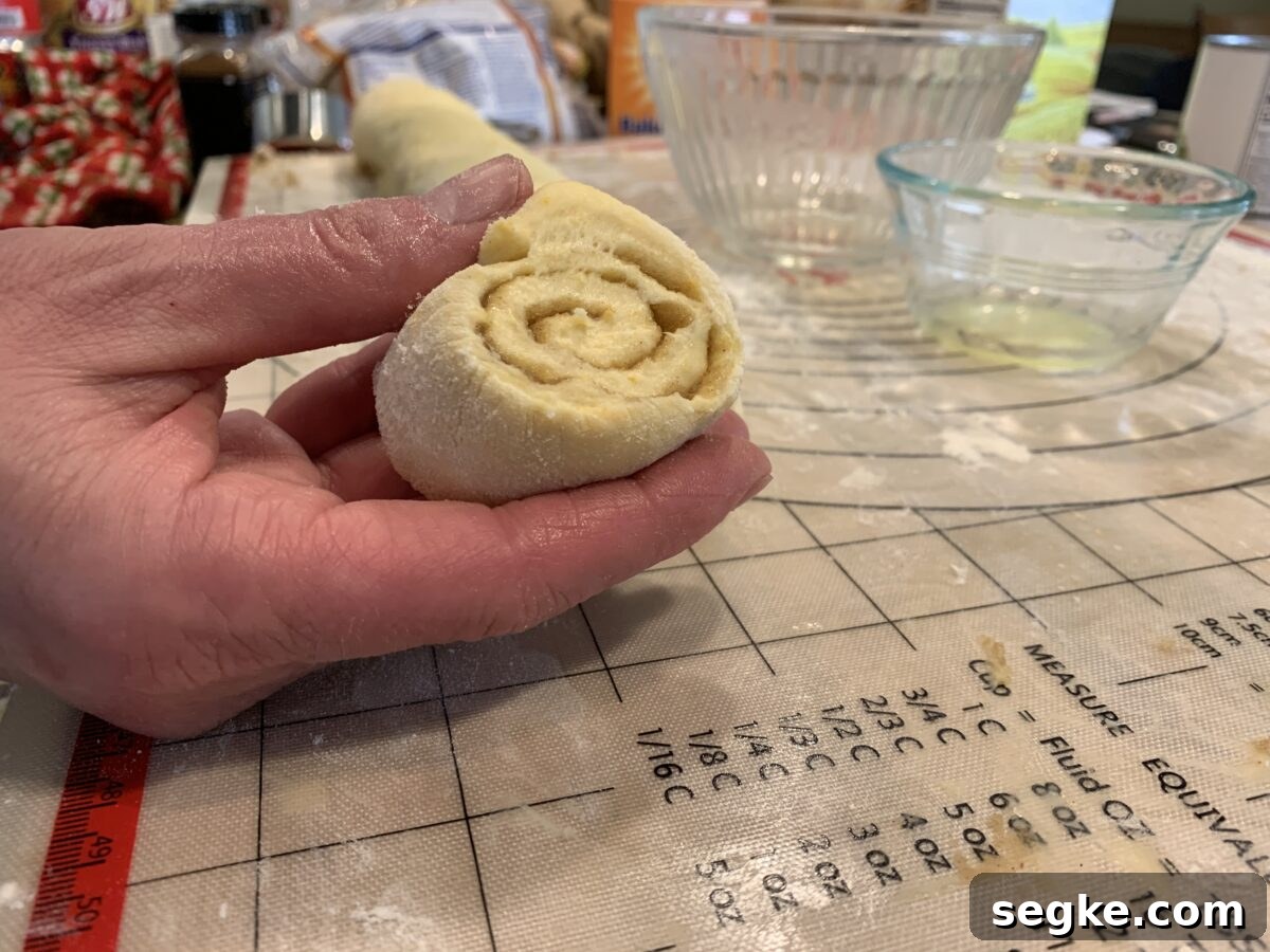 Sliced raw cinnamon roll dough.