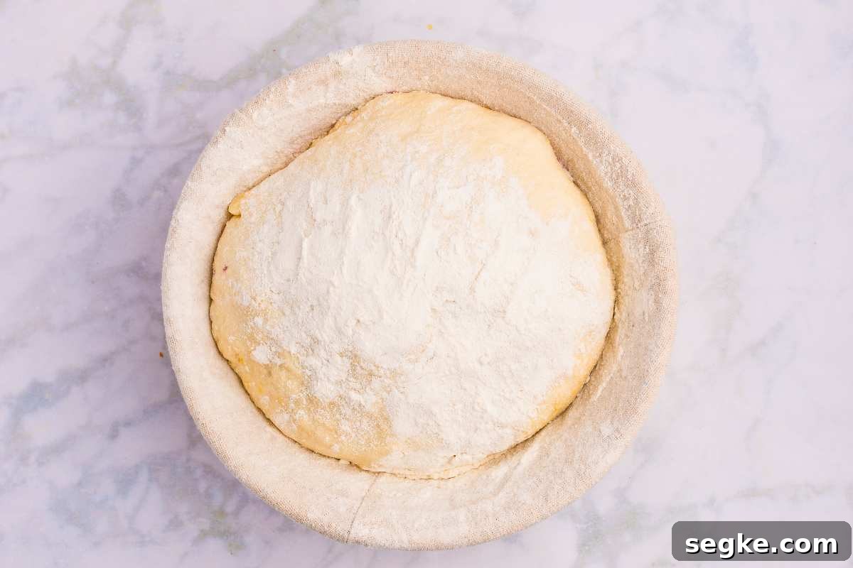 Homemade Strawberry Sourdough Bread Recipe 9 floured dough in banneton basket.