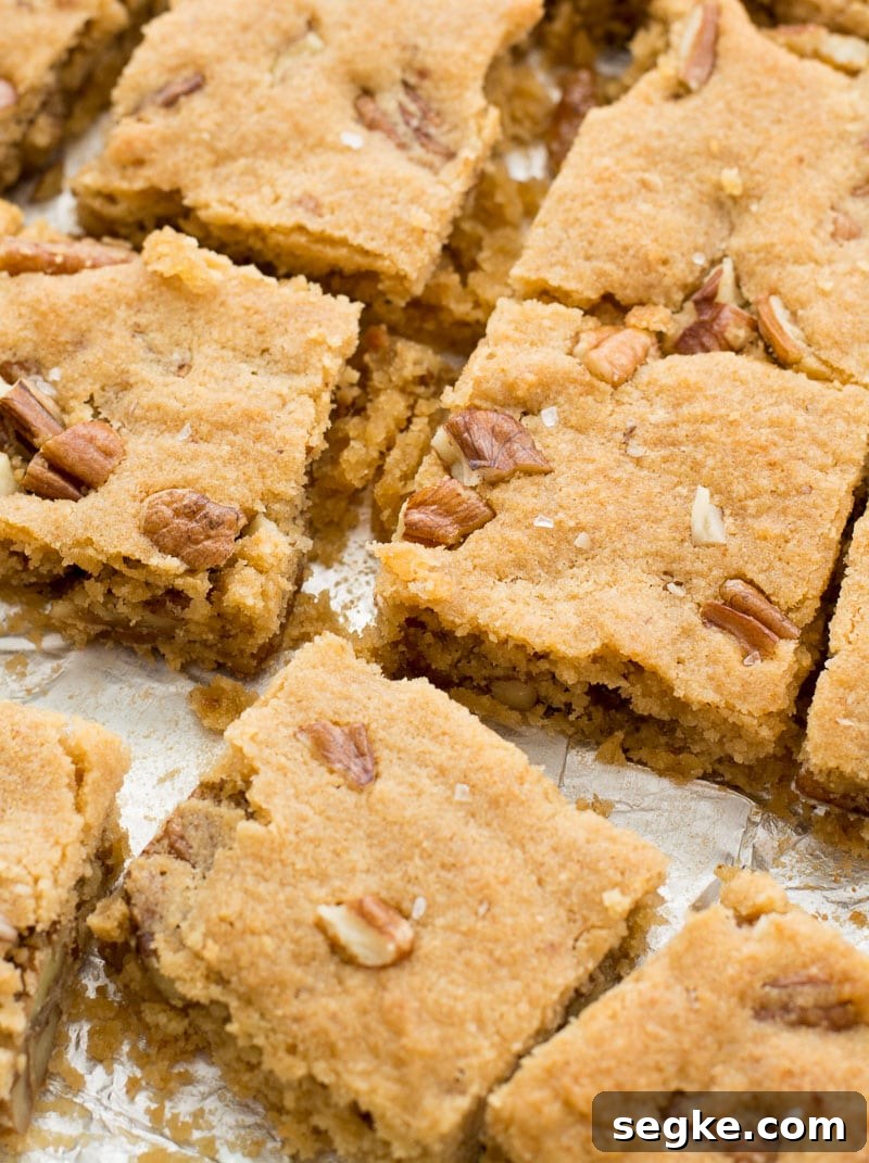 Keto Butter Pecan Blondies Recipe 3 keto blondies that have been cut into squares.