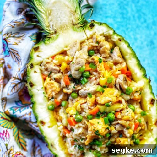 pineapple fried rice in hollowed out pineapple boat