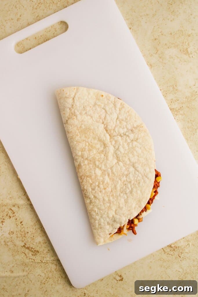 Smoky BBQ Chicken Quesadillas with Melted Cheese 9 Stuffed tortilla folded in half.