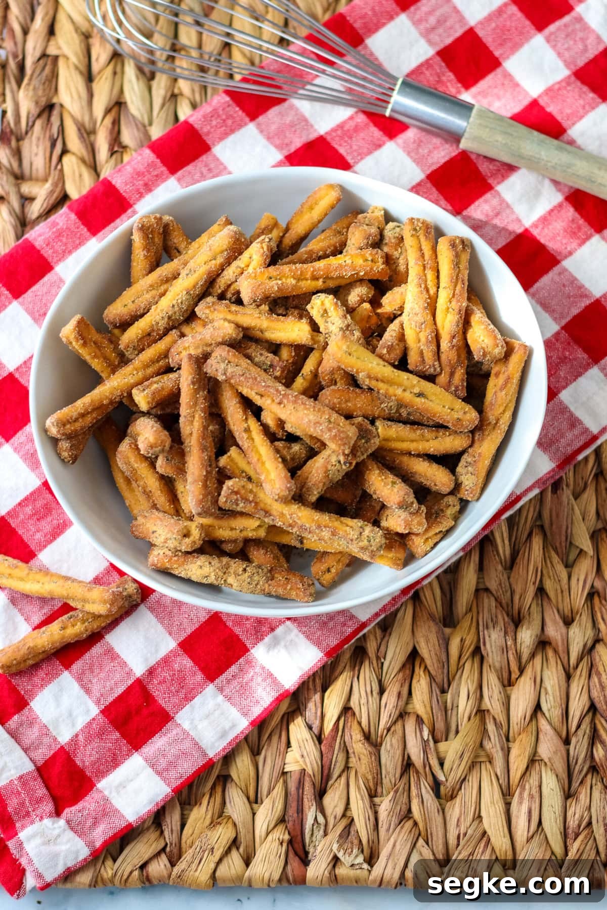 Copycat Dot's Seasoned Pretzels Recipe 5 Seasoned Pretzels on a brown mat.