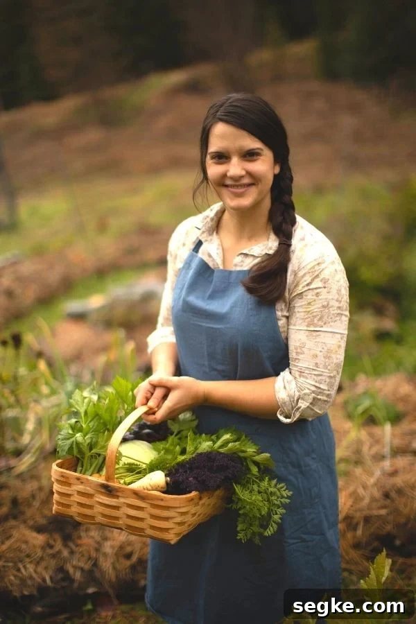 A woman in the garden carrying a basket of vegetables