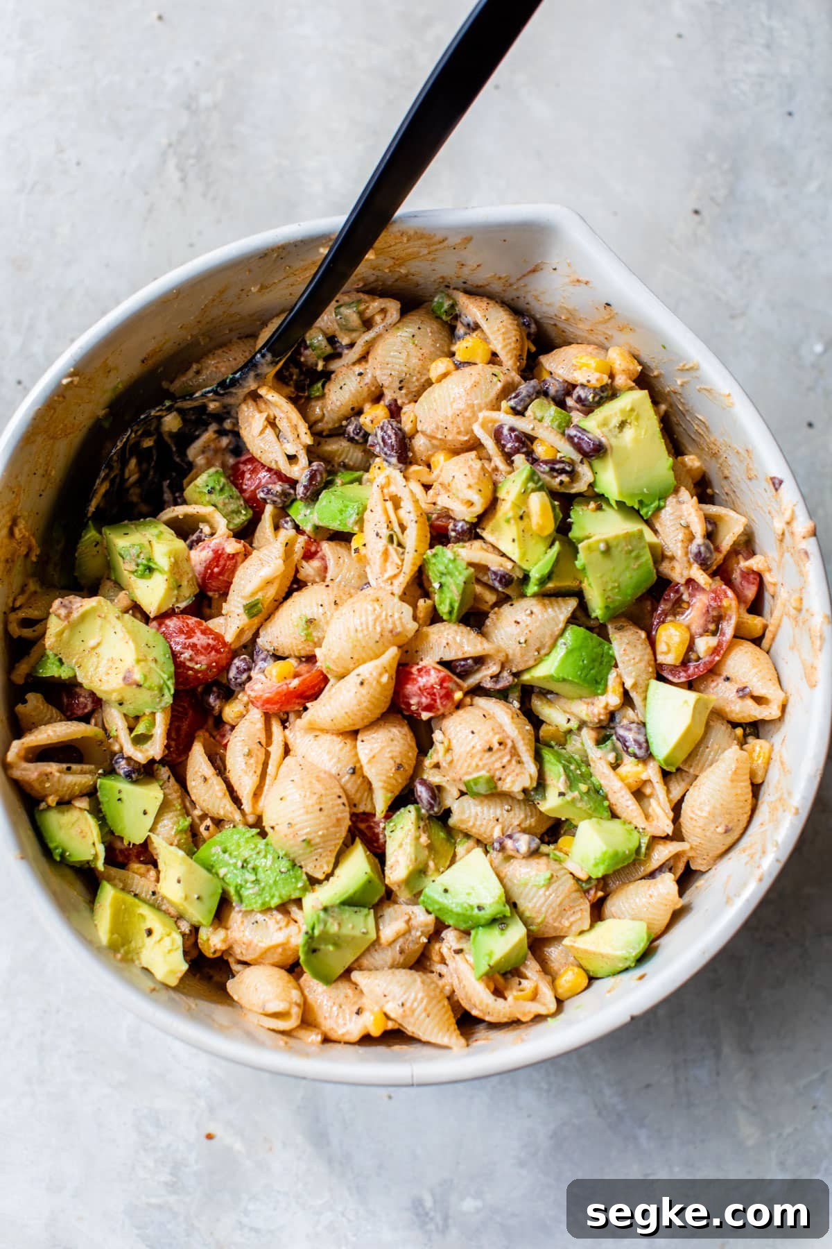 Southwest Taco Pasta Salad Recipe 4 an overview of taco pasta salad in a large bowl with a mixing spoon