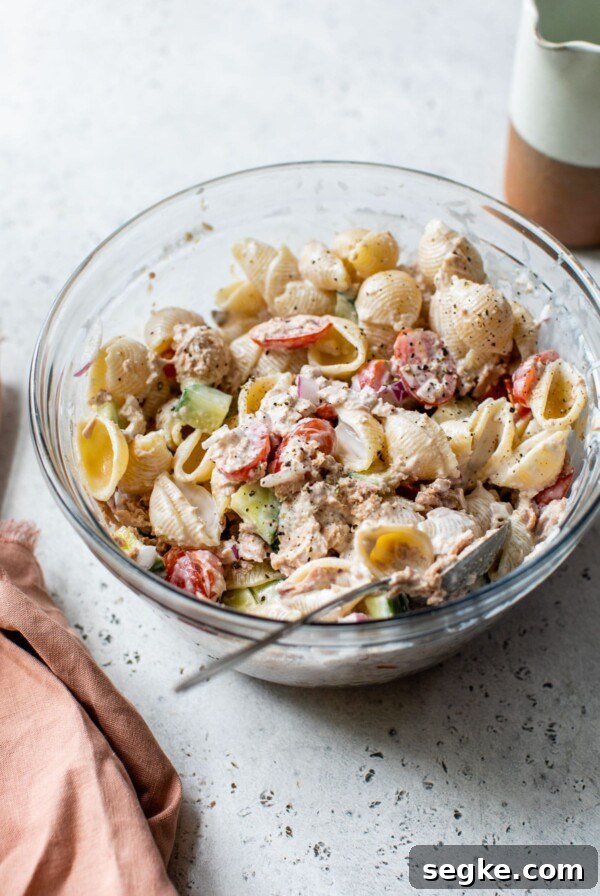 creamy tuna pasta salad in a glass bowl