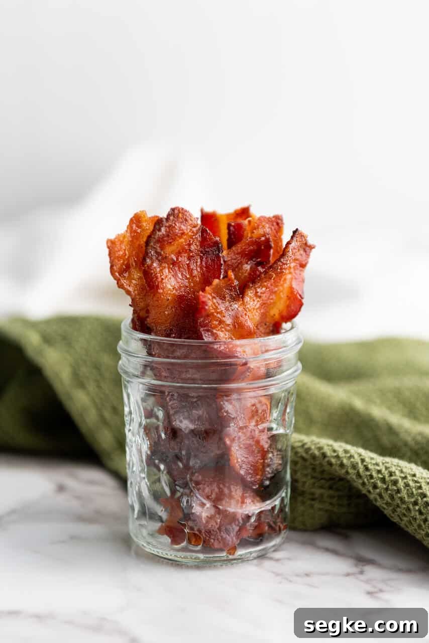 A side view of the jar of the bacon.