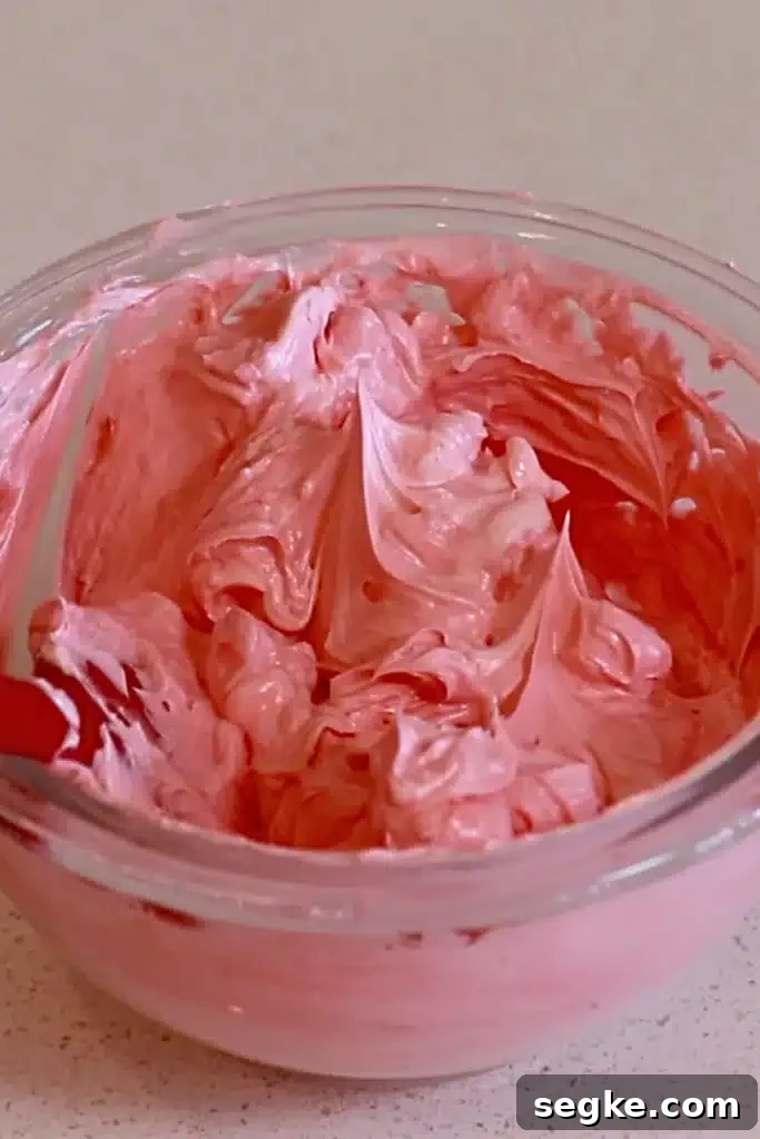 Piping colored French buttercream