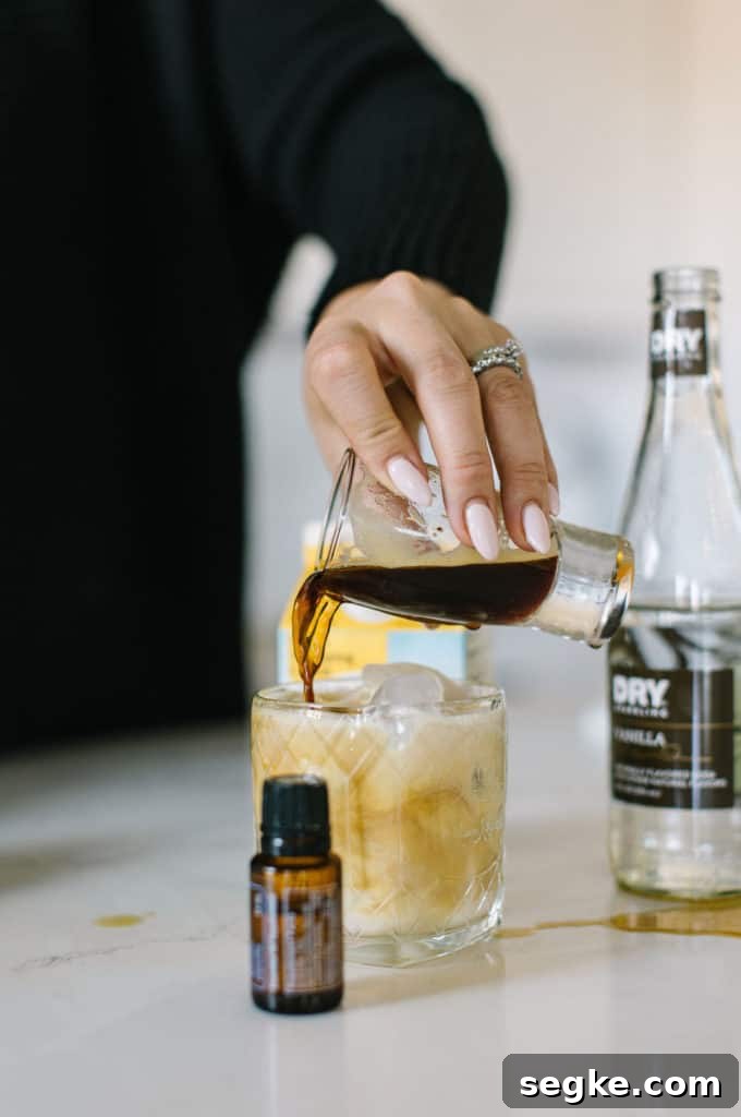 Coffee being poured into White Russian mocktail