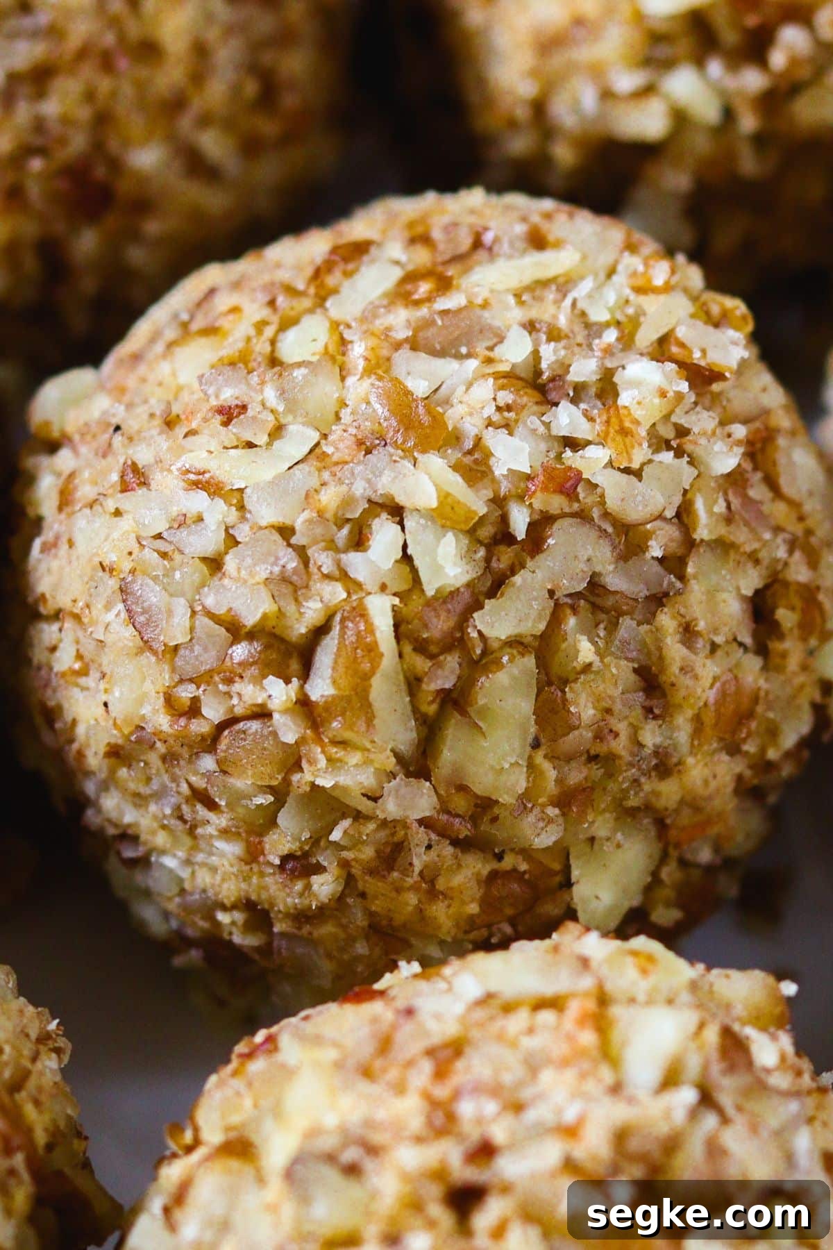 No Bake Keto Carrot Cake Protein Bites 7 Carrot cake bites rolled entirely in chopped pecans instead of white chocolate coating