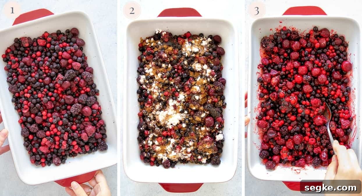 berry crisp overhead shot of mixed berries being tossed with sugar and cornstarch to make filling for berry crisp