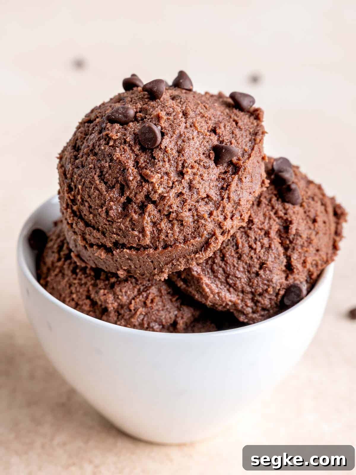 Scoops of chocolate cookie dough in a bowl.