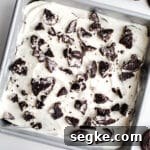 A cake topped with crushed Oreos.