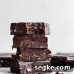 Fudgy brownies stacked on top of each other.