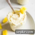 Creamy Homemade Dole Whip in a glass mason jar.