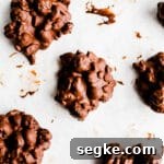 Chocolate clusters on a piece of parchment paper.