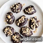 Chocolate-dipped dates on a plate.