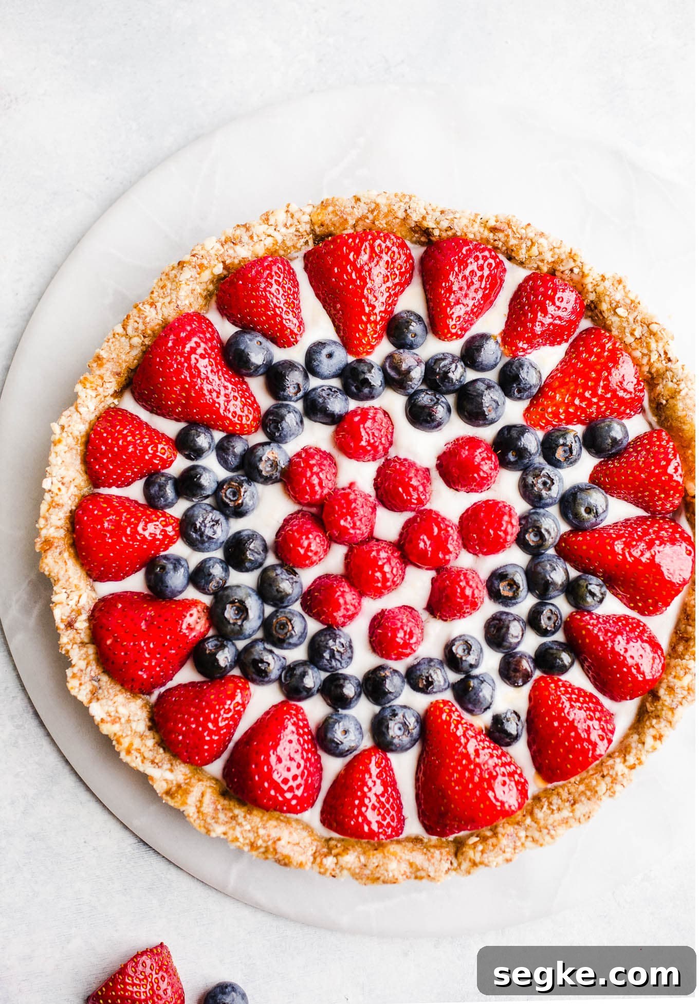 No-Bake Berry Tart on a marble lazy susan.