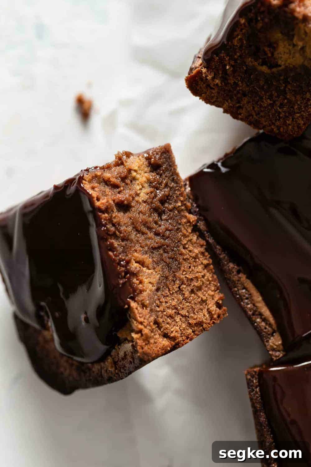Fudgy Pumpkin Brownies with Cinnamon Chocolate Swirl 2 Close up of pumpkin brownie turned on its side to show the pumpkin swirl layer
