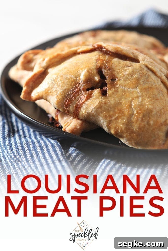 A platter holds meat pies, with Pinterest text