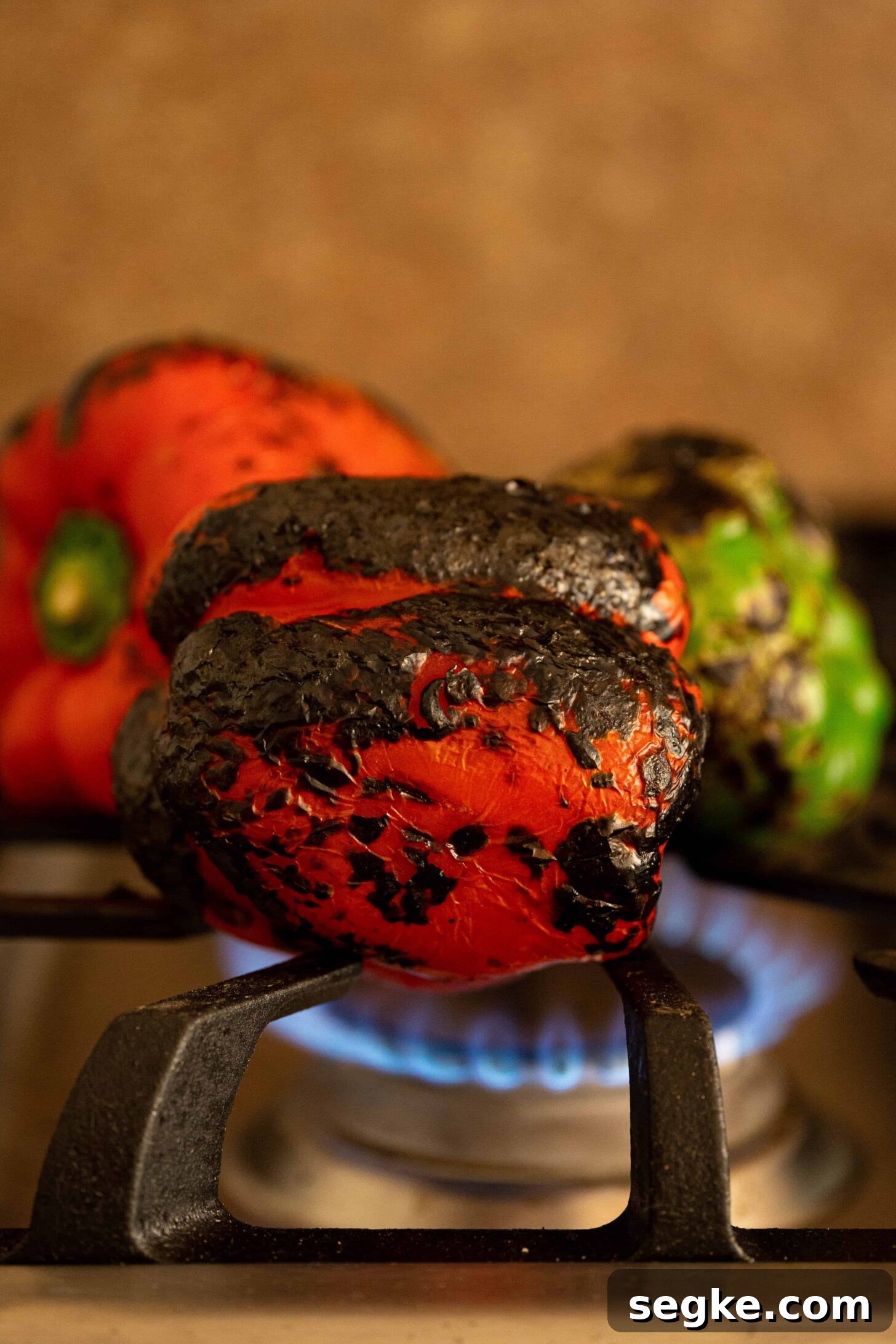 peppers roasting over a flame