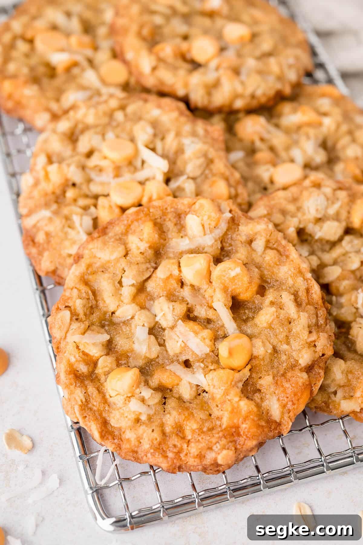 Chewy Coconut Butterscotch Cookie Recipe 2 Coconut butterscotch cookies on a wire rack.