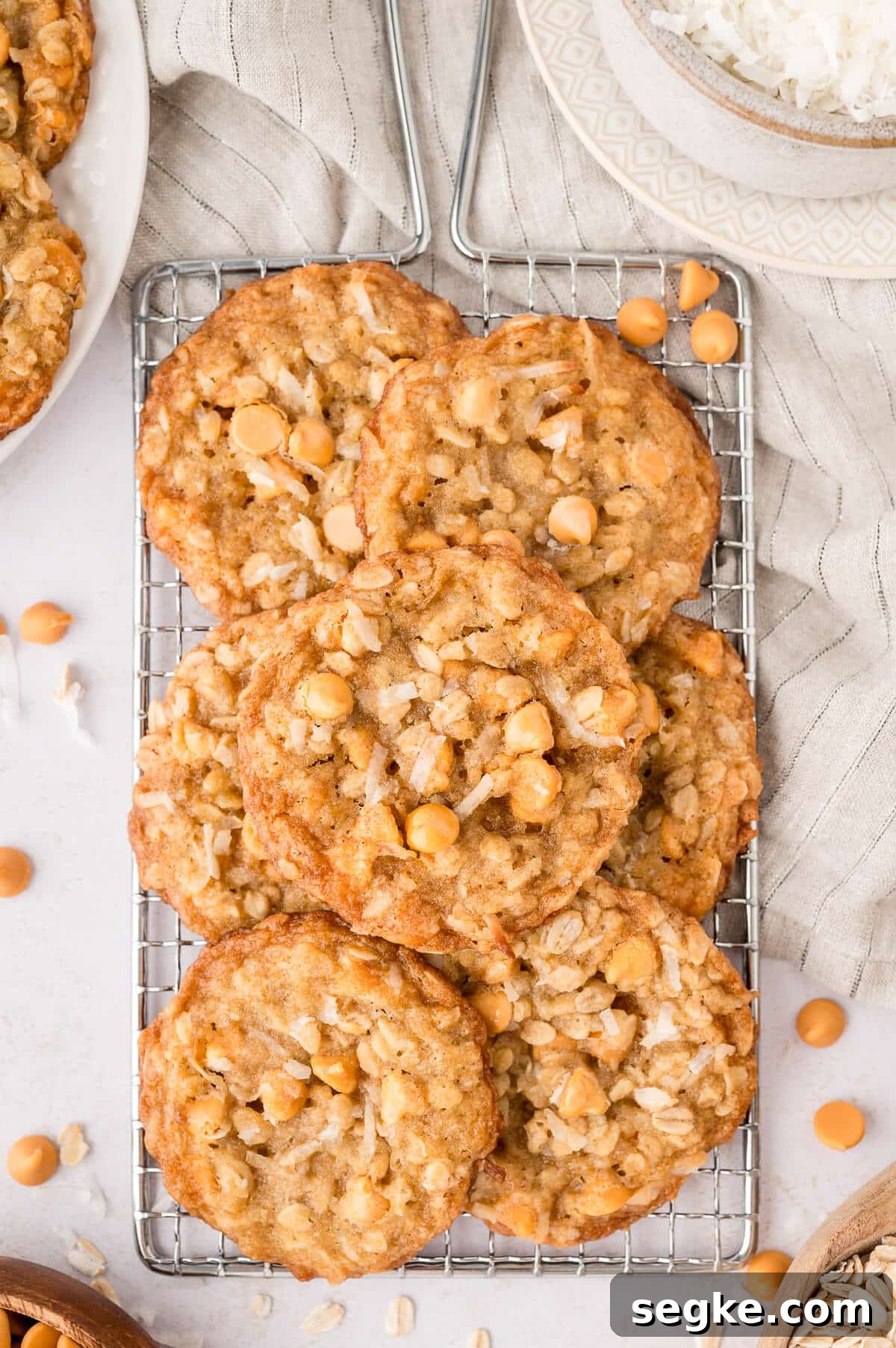 Chewy Coconut Butterscotch Cookie Recipe 7 Coconut butterscotch cookies on a wire rack.