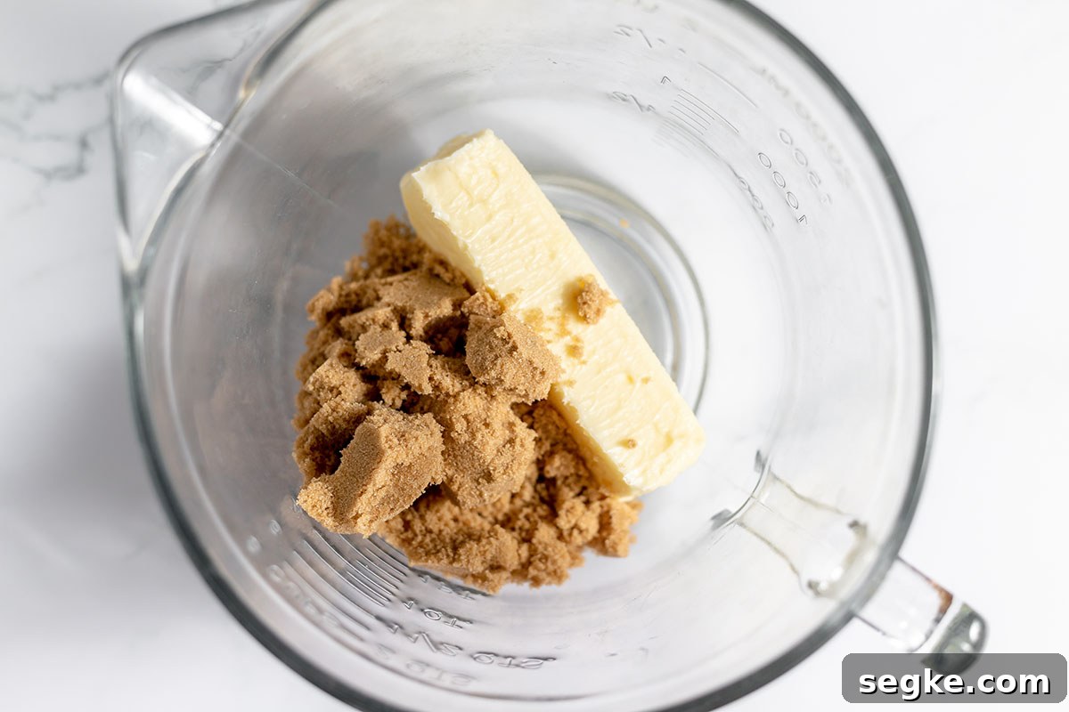 Mini Peppermint Cheesecake Cookie Cups Recipe 4 Brown sugar and butter in a glass mixing bowl.
