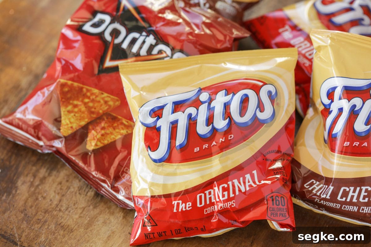 Walking Tacos: Portable Taco Cups for Parties and Tailgates 3 Small bags of fritos and doritos on a table.