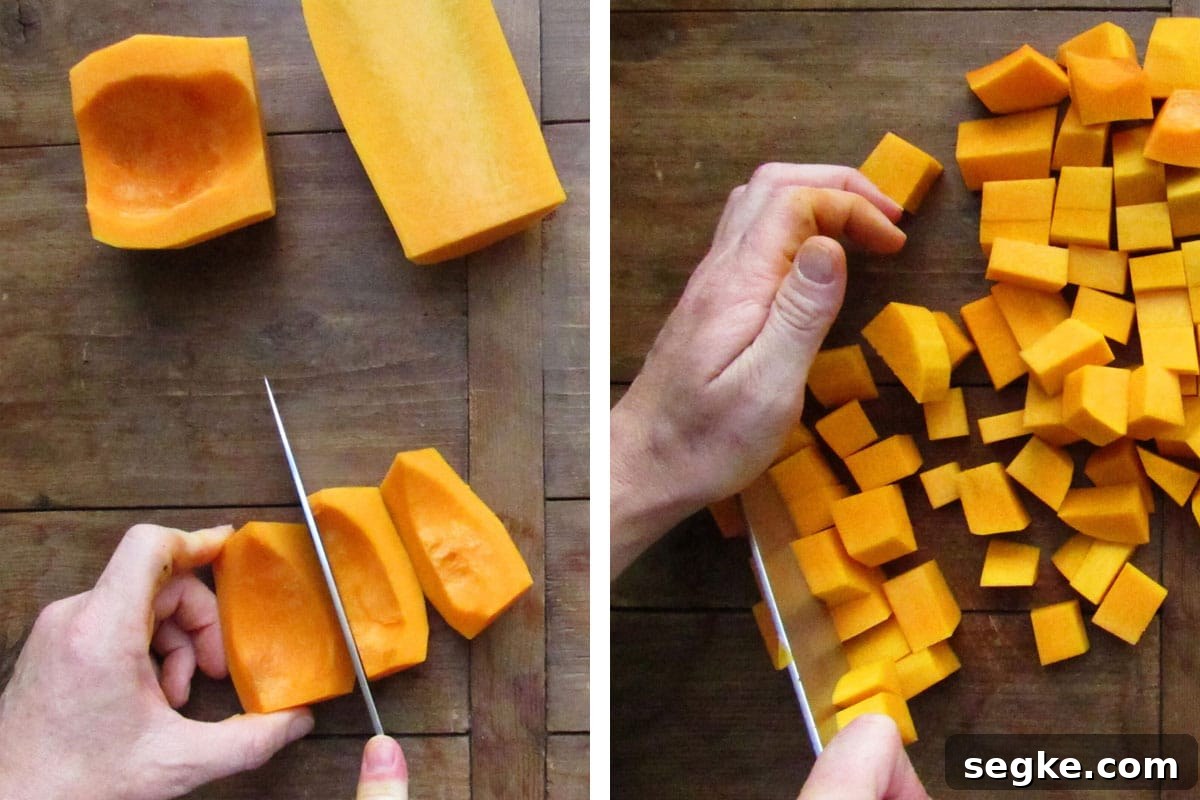 Cutting butternut squash into cubes with knife.