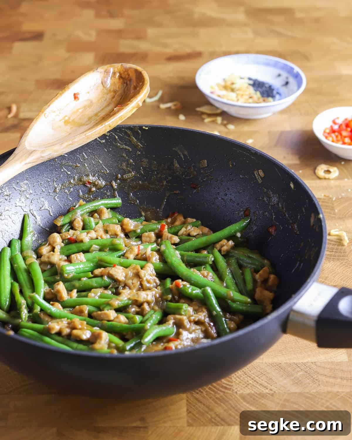 photo of a pan of vegan chinese green beans and tempeh