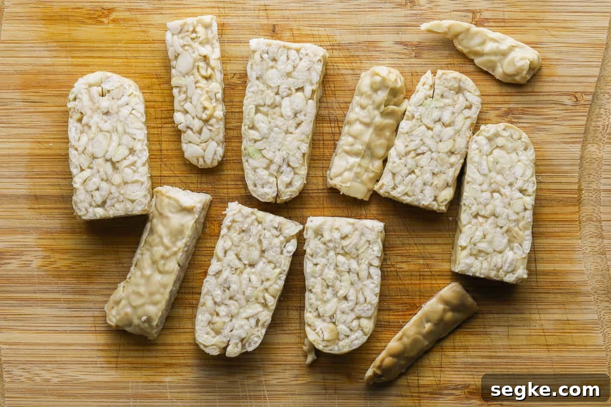 photo of pieces of tempeh on a chopping board