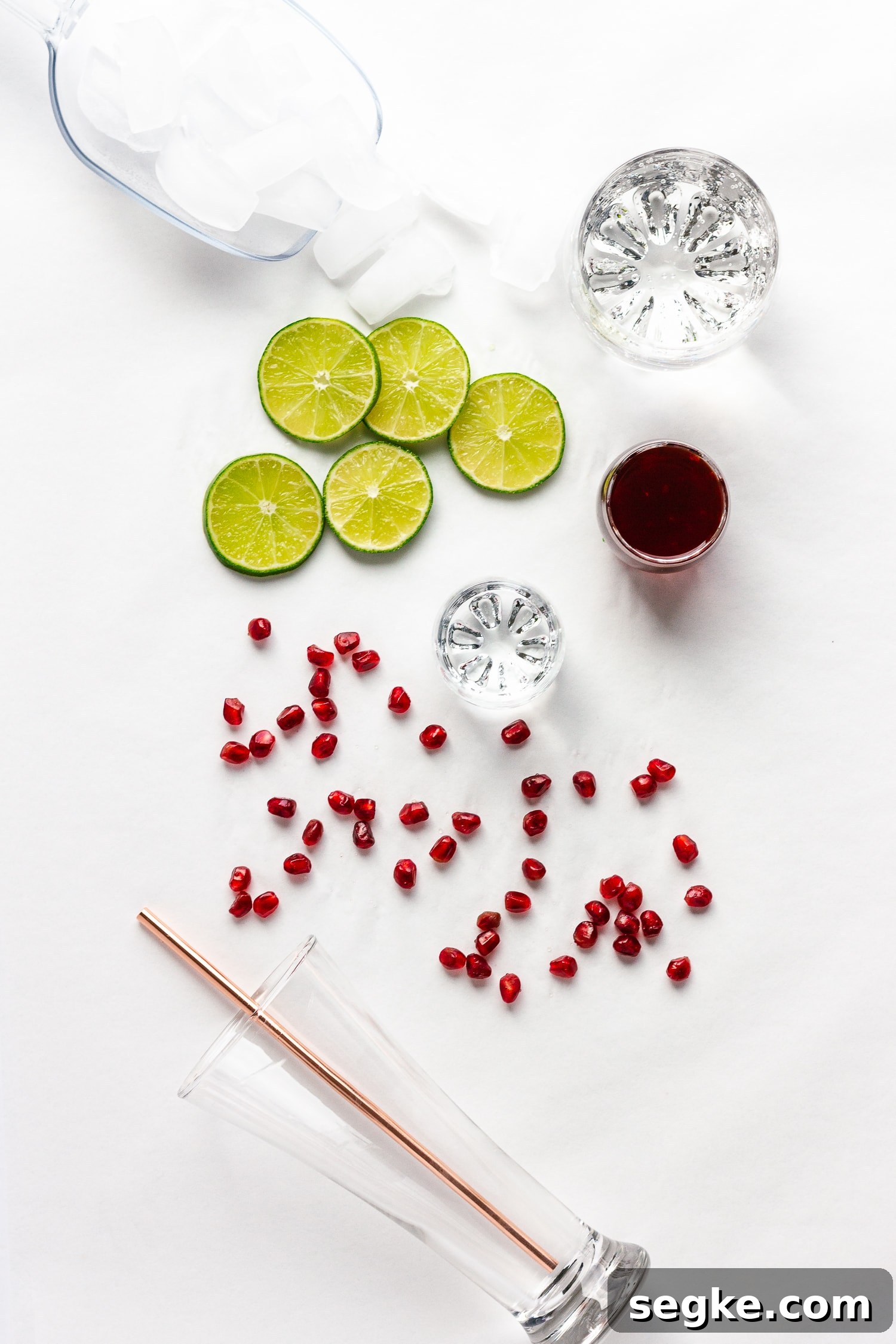 Sparkling Pomegranate Lime Spritzer Recipe 3 Overhead shot of all the ingredients needed to make the Pomegranate Lime Spritzer cocktail recipe