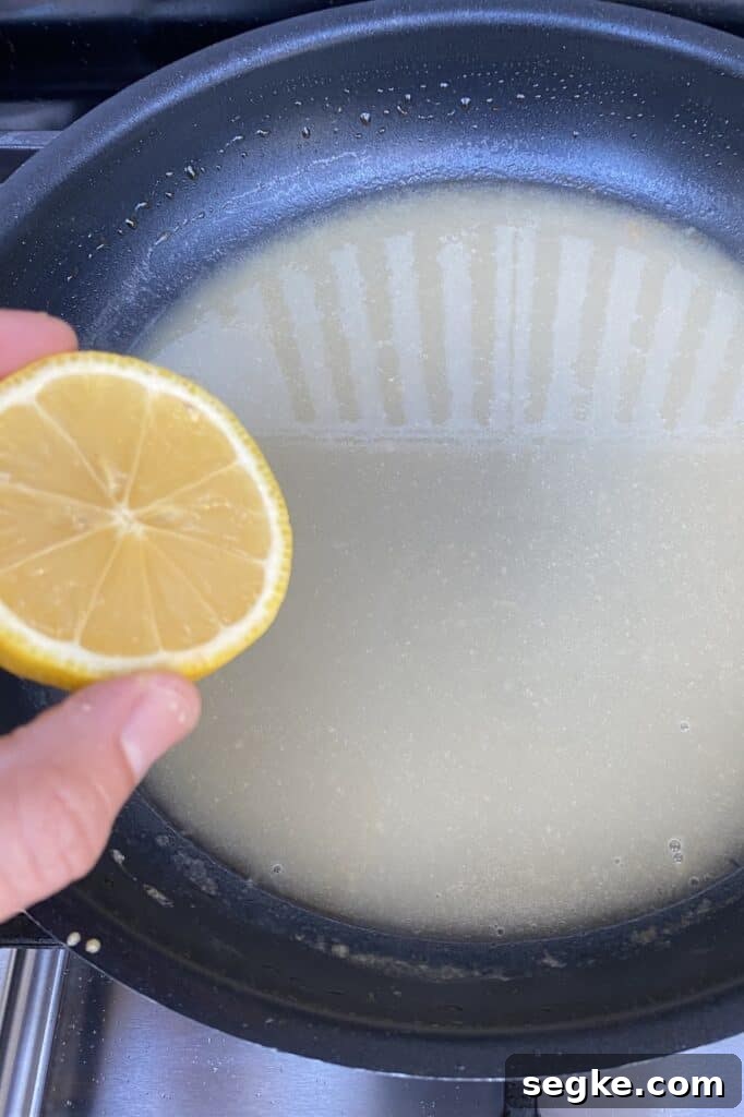 Adding lemon juice to sauce.