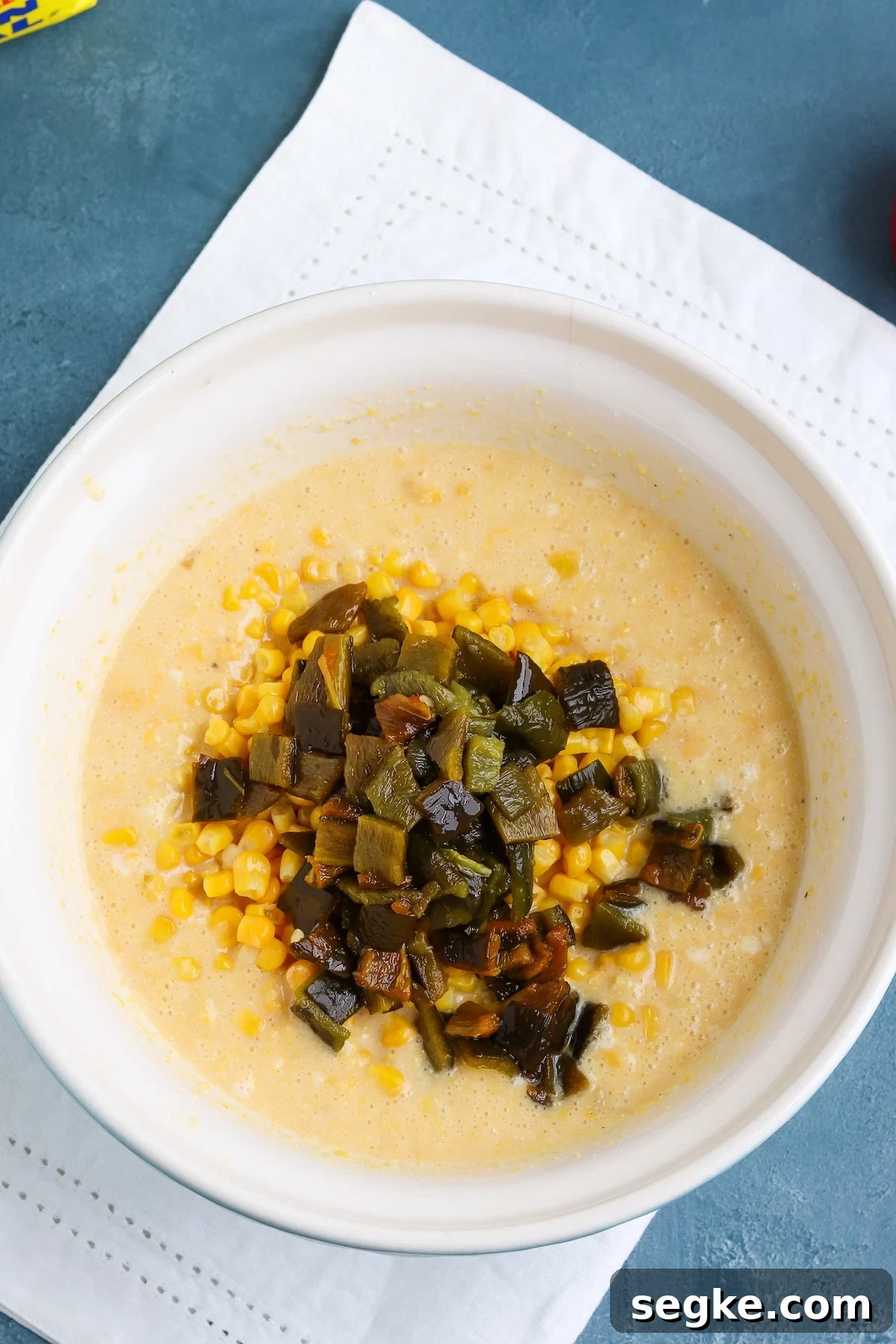 Creamy Poblano Corn Casserole Recipe 6 corn casserole batter with chopped poblano peppers and corn kernels