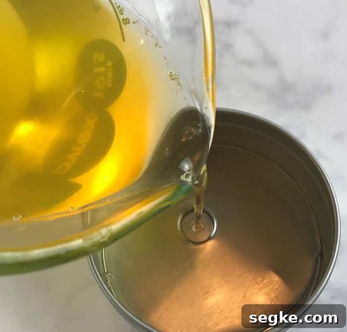 Pouring the foot rub into containers.