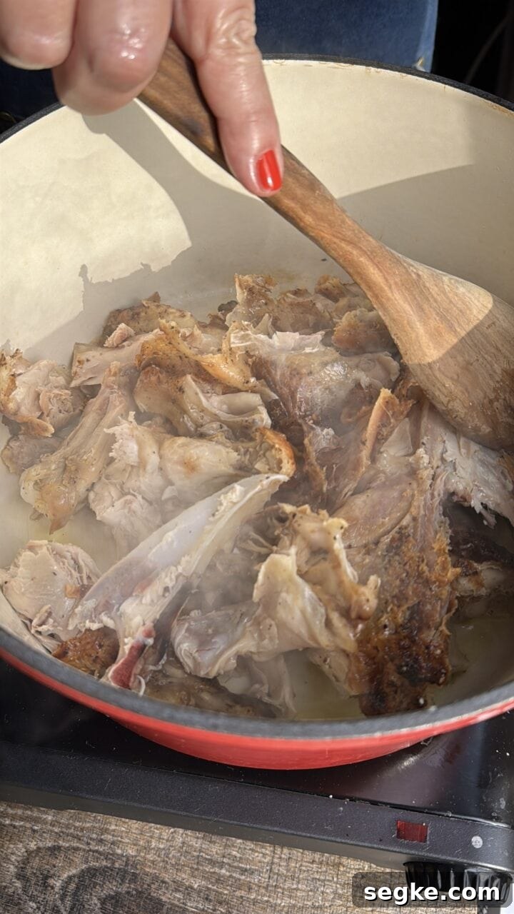 crisping the chicken bones in a pot