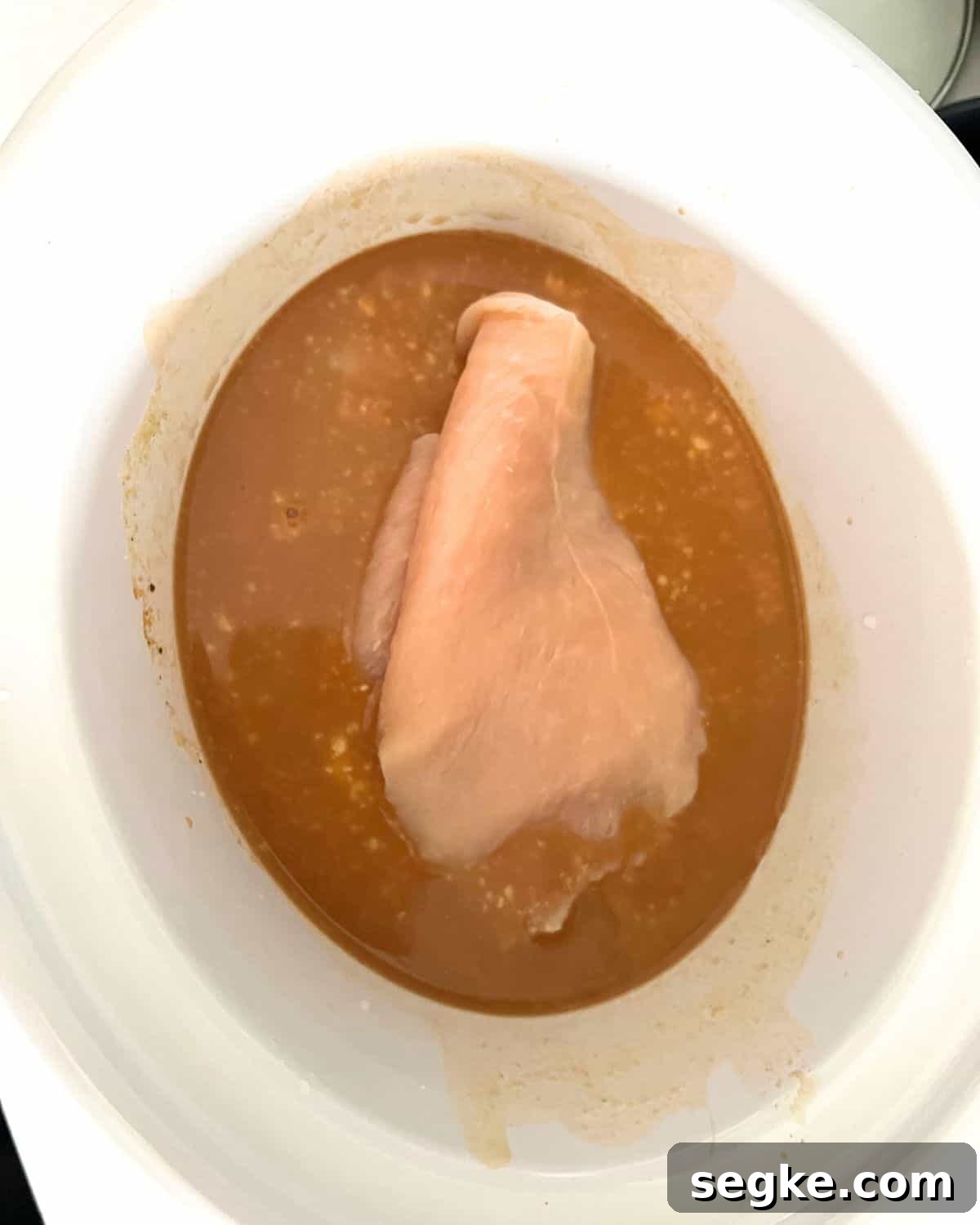 Gravy and chicken in crock pot.
