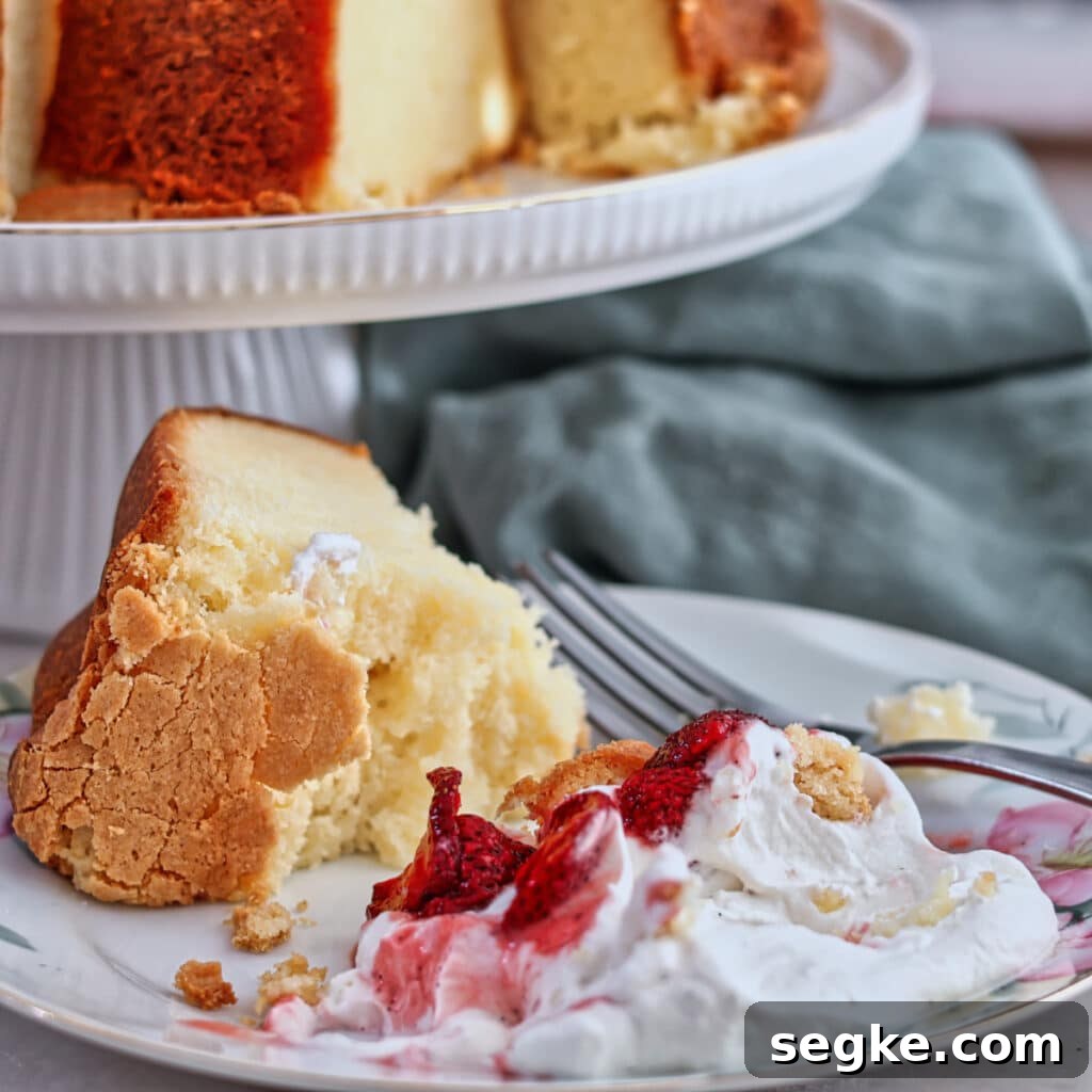 Moist Gluten-Free Pound Cake Recipe 10 slice of half eaten pound cakes on plate with whole pound cake in the background.