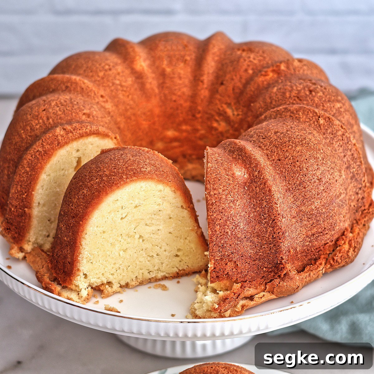 Moist Gluten-Free Pound Cake Recipe 9 full pound cake with a slice taken out of it.