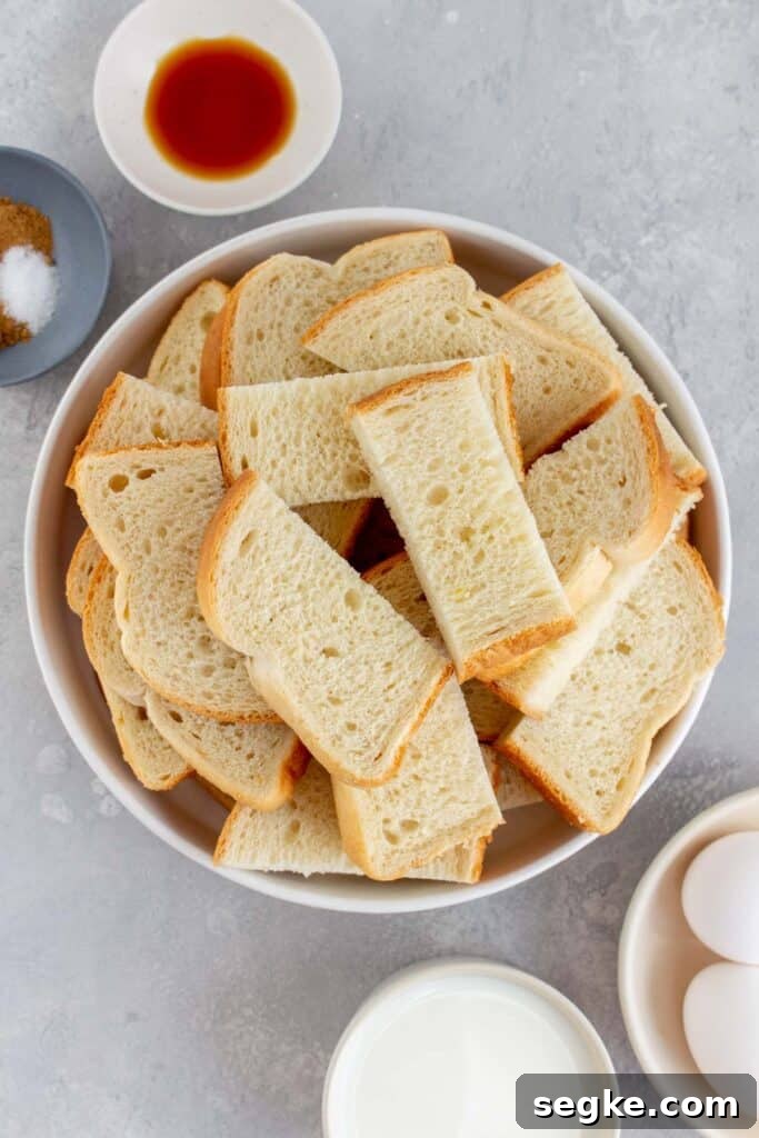Bread slices cut into 3, all in a bowl.