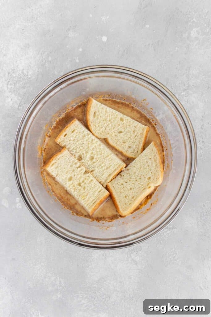 Bread slices added to the french toast mixture.