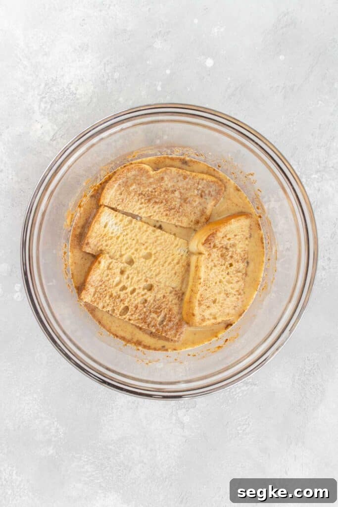 Bread coated in french toast mixture.