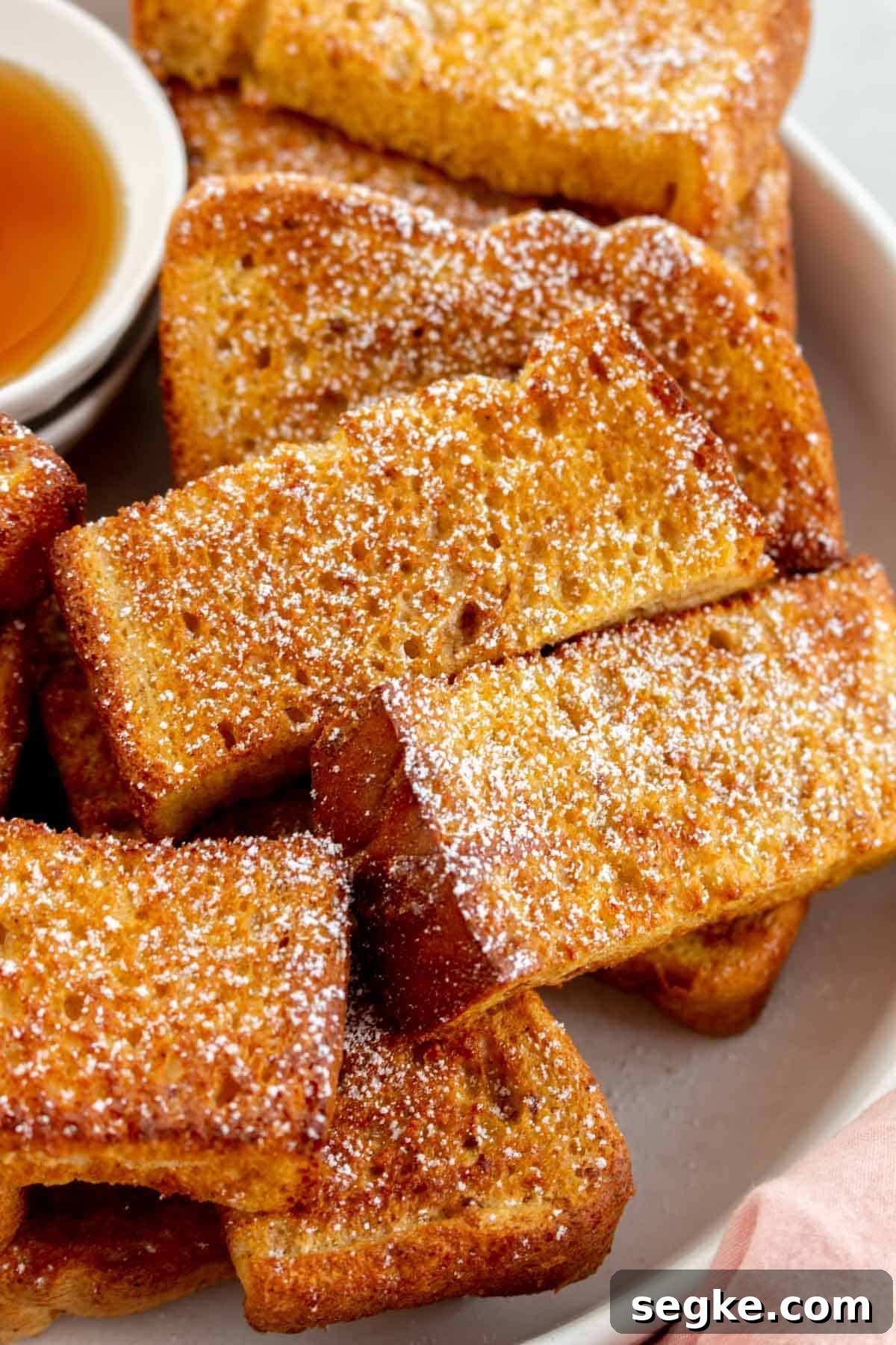 Close up of air fryer french toast sticks.