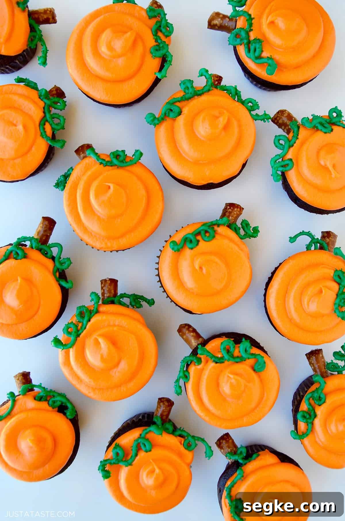 Spooky Halloween Dessert Recipes to Impress Guests 9 Chocolate Halloween cupcakes with orange frosting to look like a pumpkin patch.