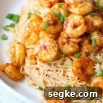 Spicy Chicken and Shrimp served on noodles
