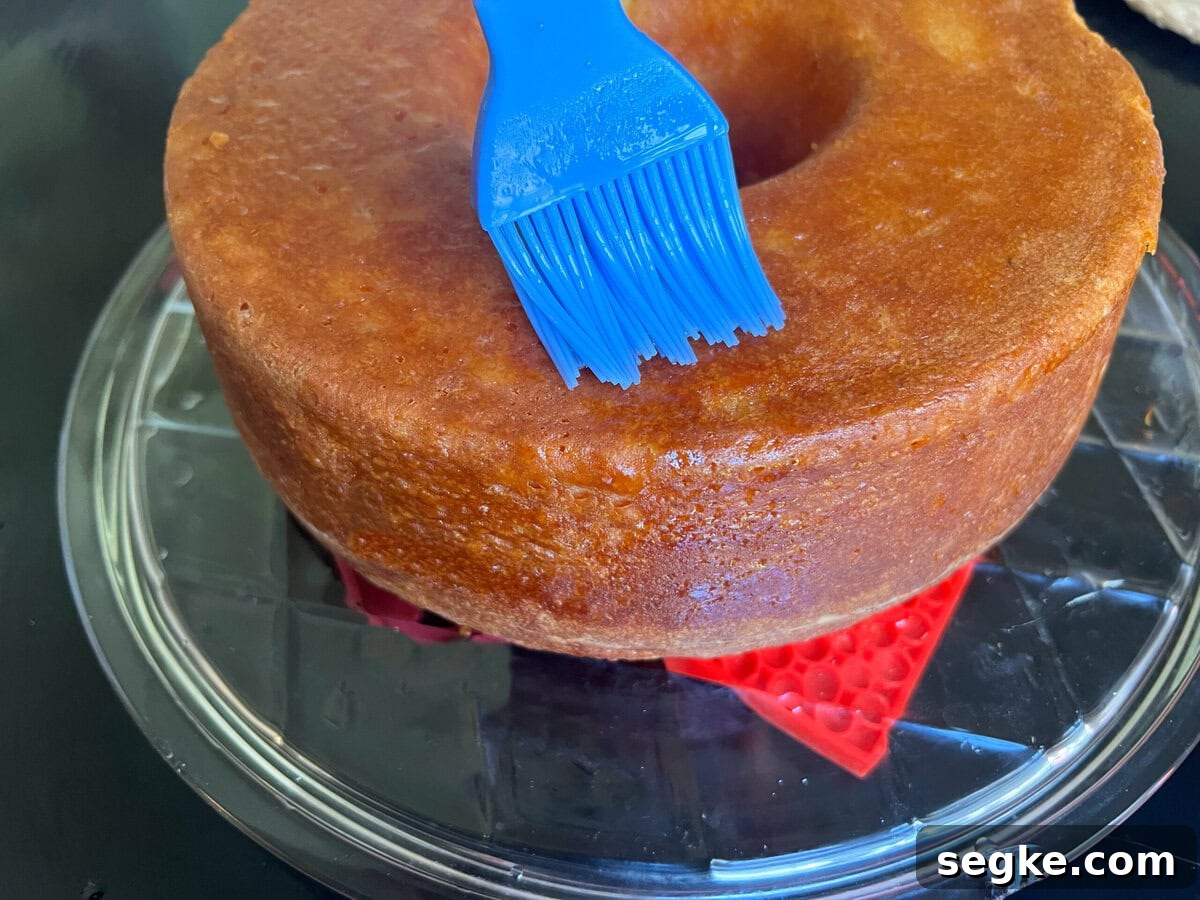Margarita Pound Cake with Tequila Lime Glaze 5 Glazing the Margarita Pound Cake.